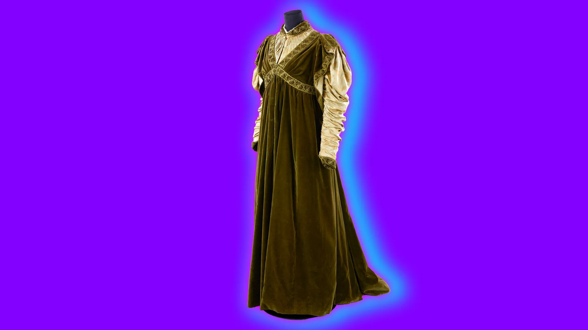 A velvet green medieval style dress with cream sleeves set against a purple background with a blue halo.