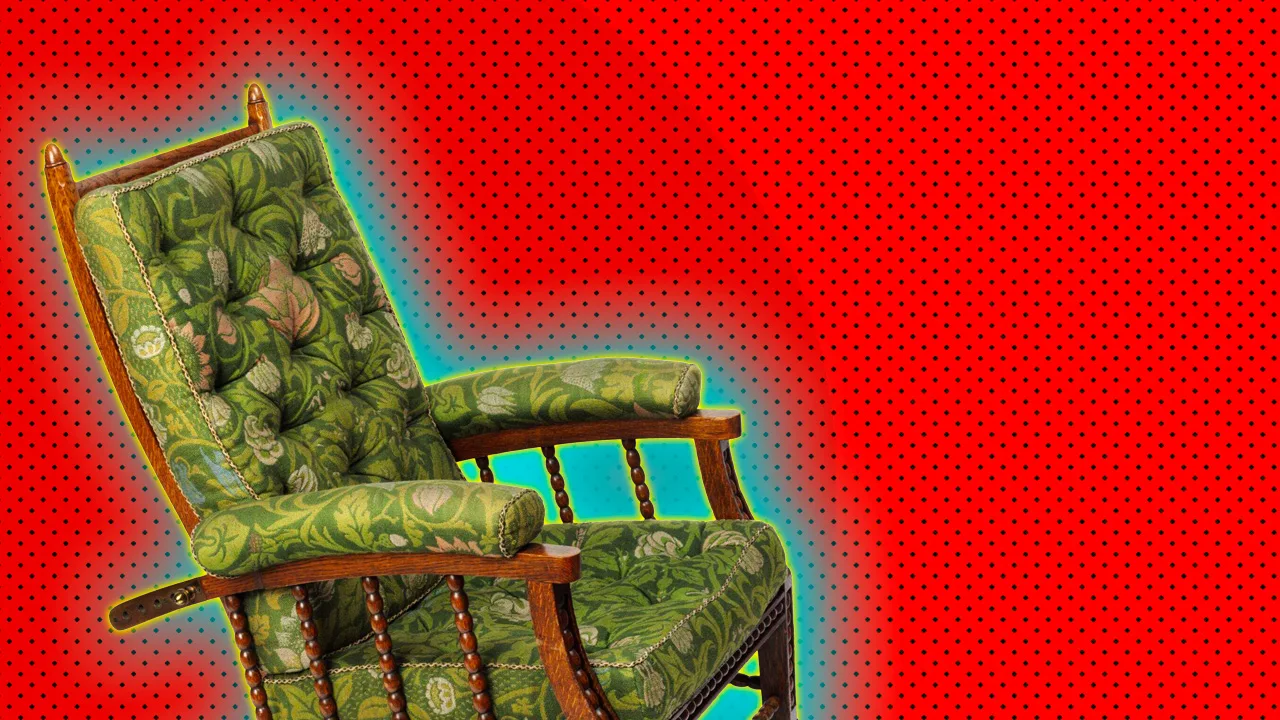 An image of a chair upholstered in a green and yellow William Morris furnishing. It is set against a red dotted background with a blue halo.