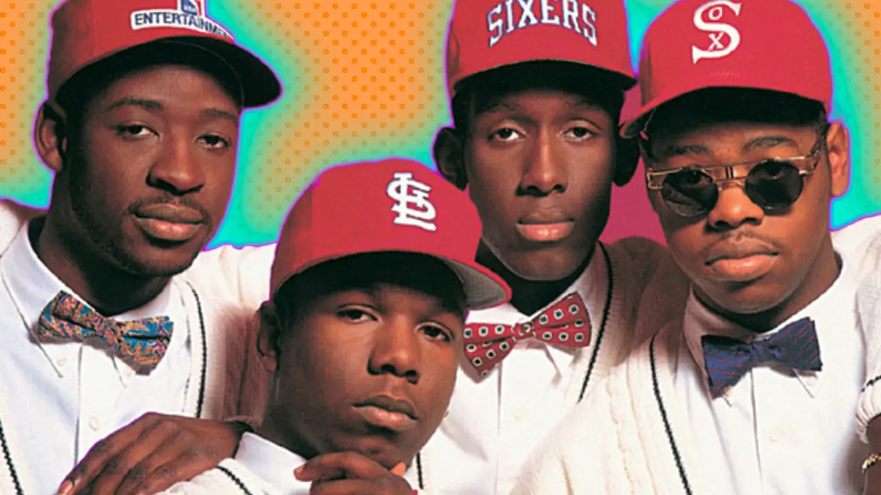 Boyz II Men showing the four band members wearing red caps and white shirts and cardigans against an orange background with blue halos.