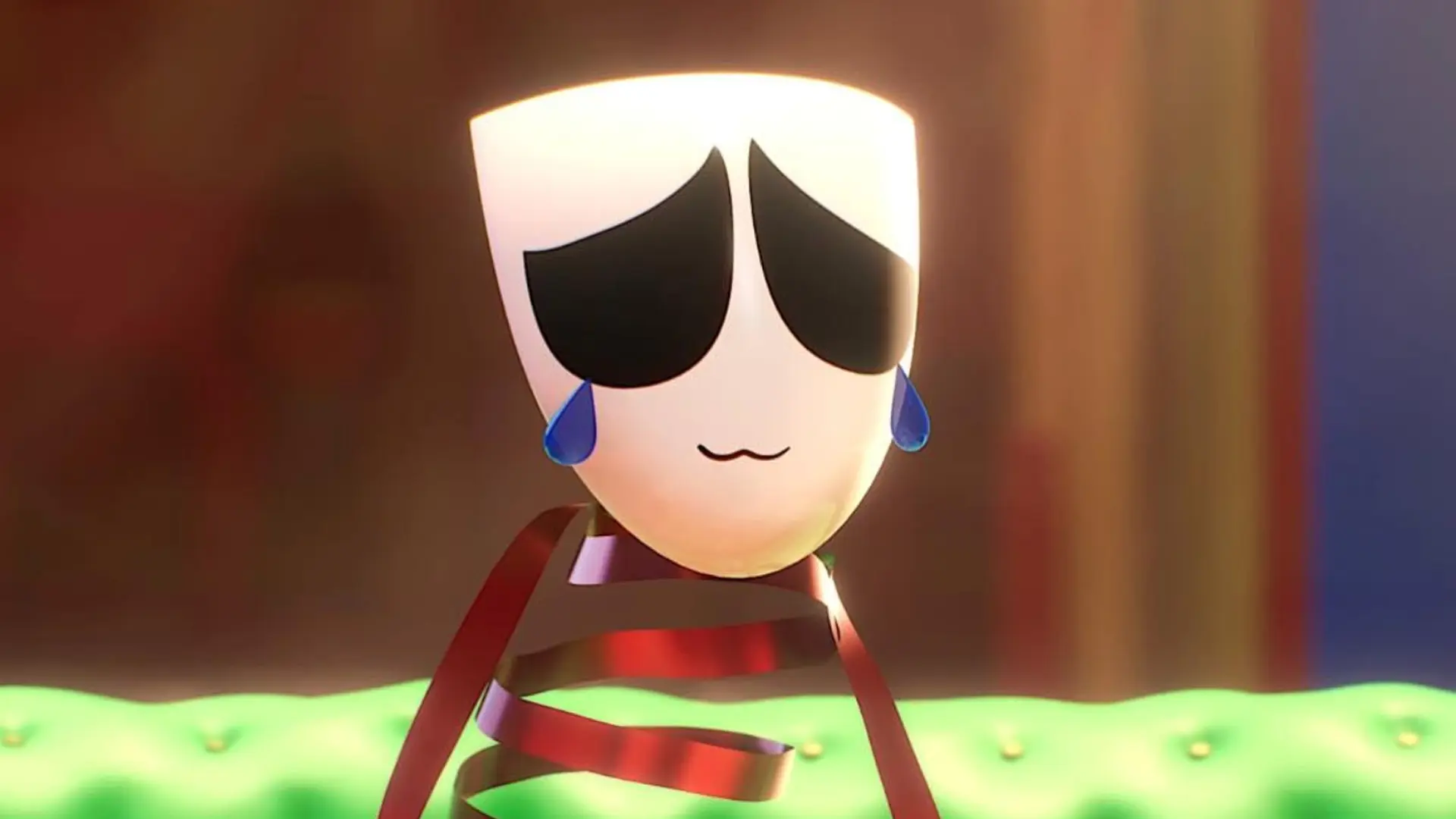 A still from The Amazing Digital Circus showing Gangle crying with a smile in a room with green floor and brown walls.