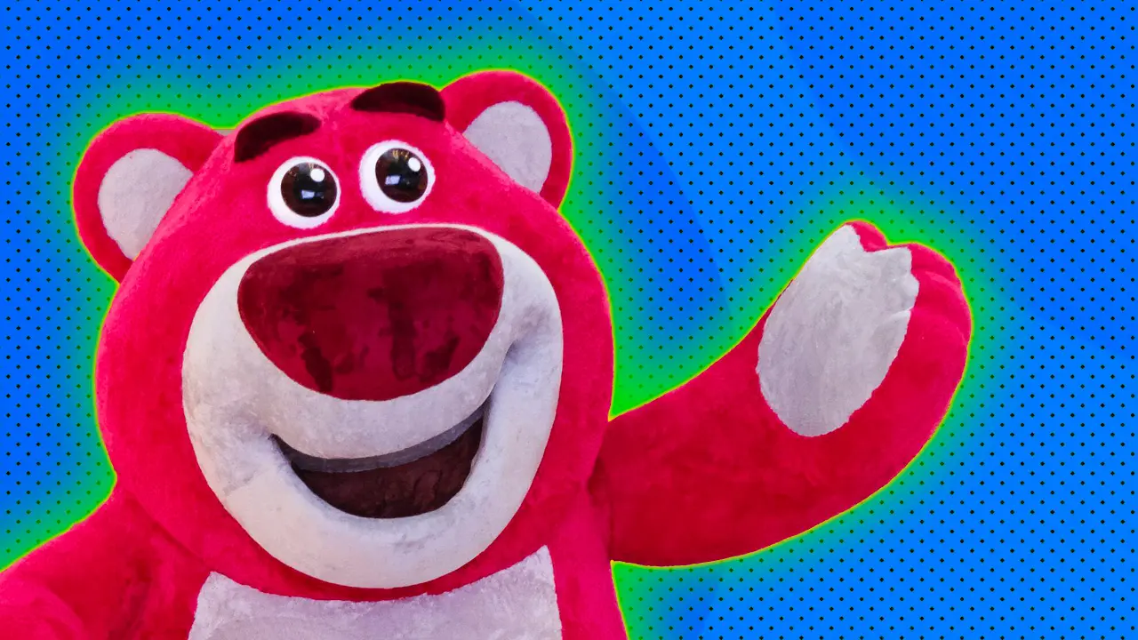 A photo of Lotso from Toy Story waving and smiling set against a blue background with a green halo.