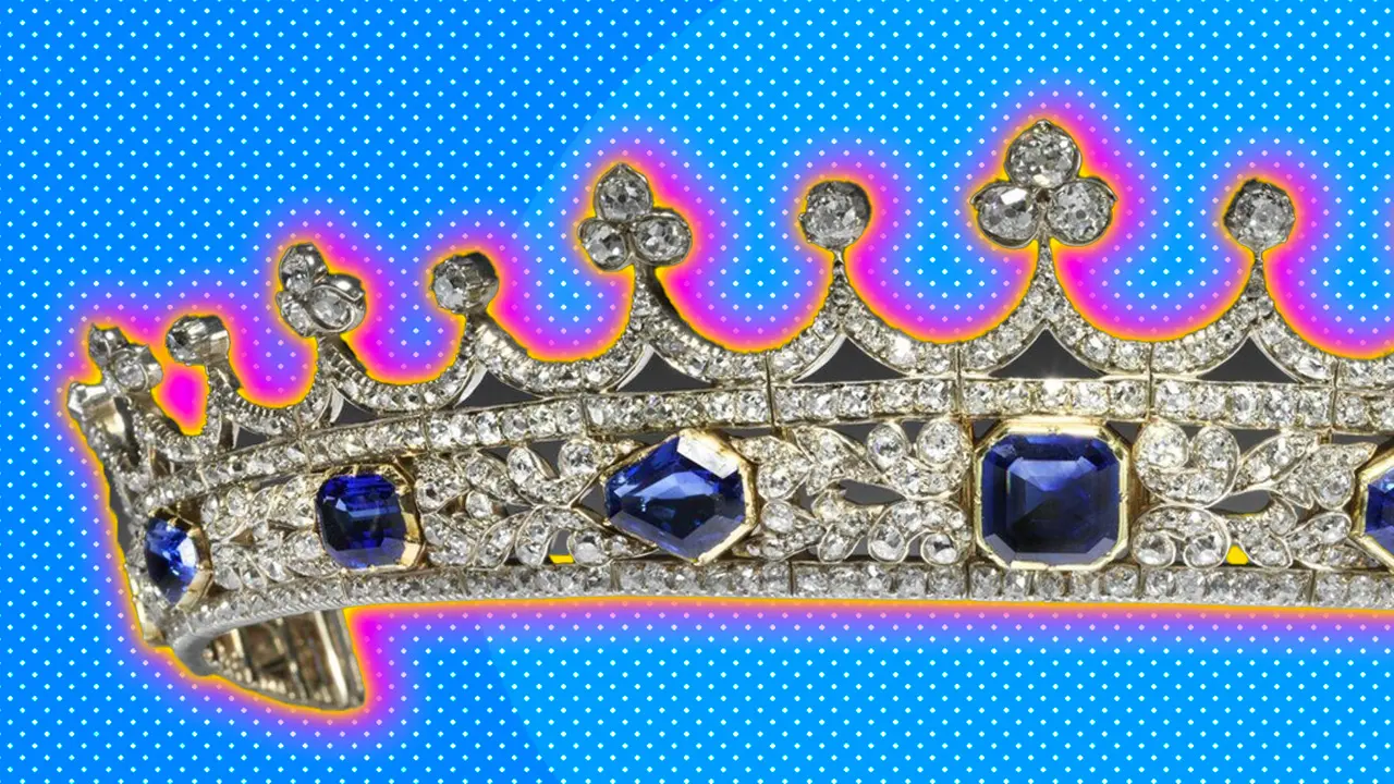 An image of Queen Victoria's sapphire and diamond coronet set against a blue dotted background with a pink halo.