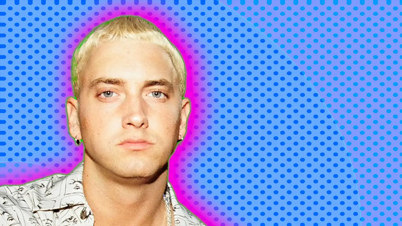 A photo of Eminem looking at the viewer with his signature bleach blonde cropped hair set against a blue dotted background with a green and pink halo.