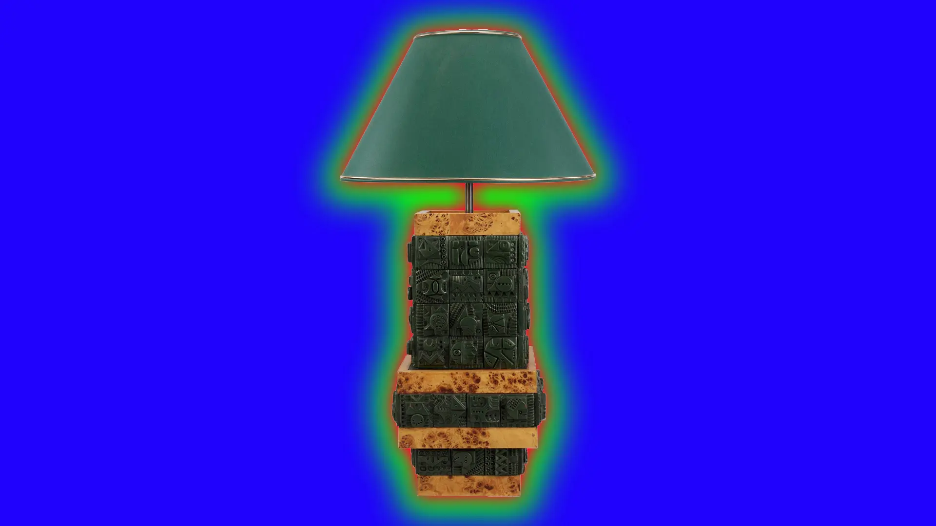 An image of a mid-century table lamp with a deep green shade and jade carved base with wood tiers set against a royal blue background with a green halo.