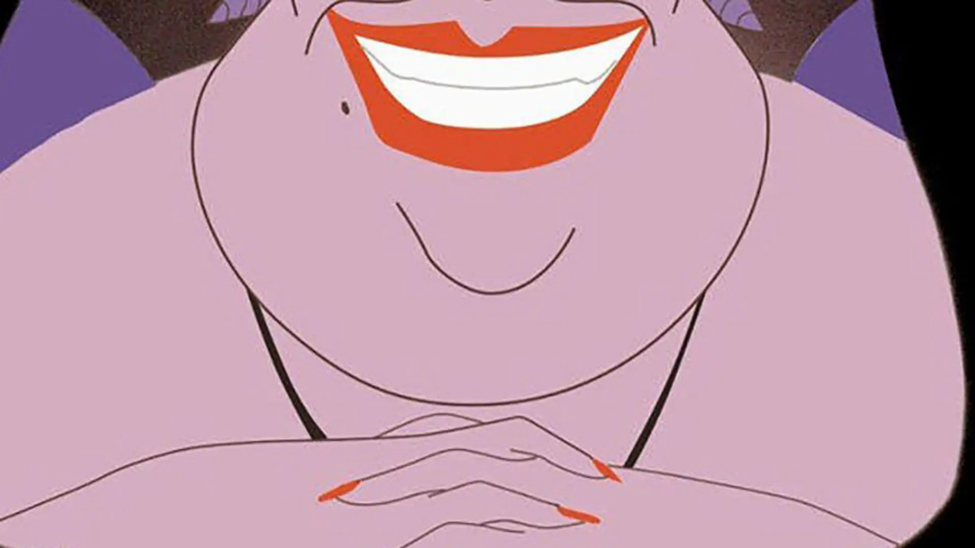 A still from The Little Mermaid showing a close up of a purple skinned woman smiling with her hands clasped together.