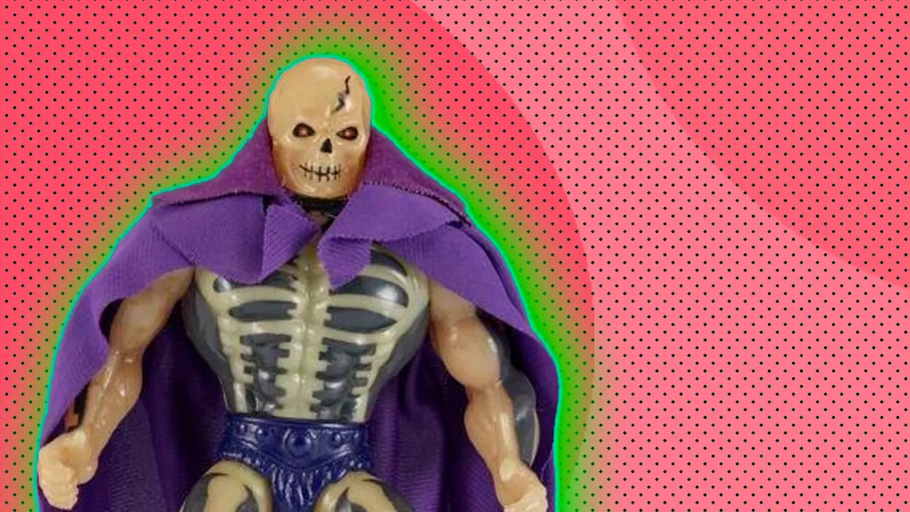 An image of a Skeletor toy with a purple cape and underwear set against a pink dotted background with a green halo.