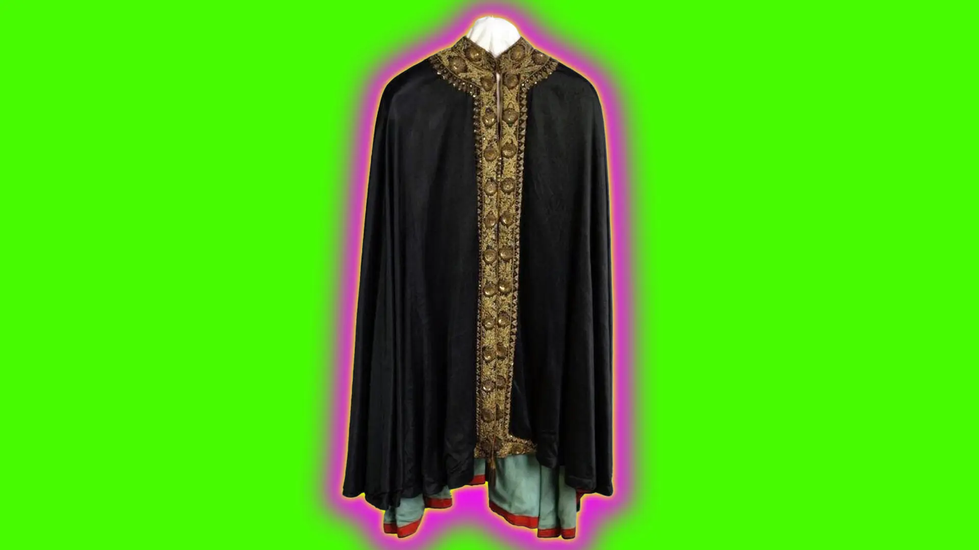 A photo of a velvet cloak with a gold ornate border trim set against a neon green background with pink and yellow halo.