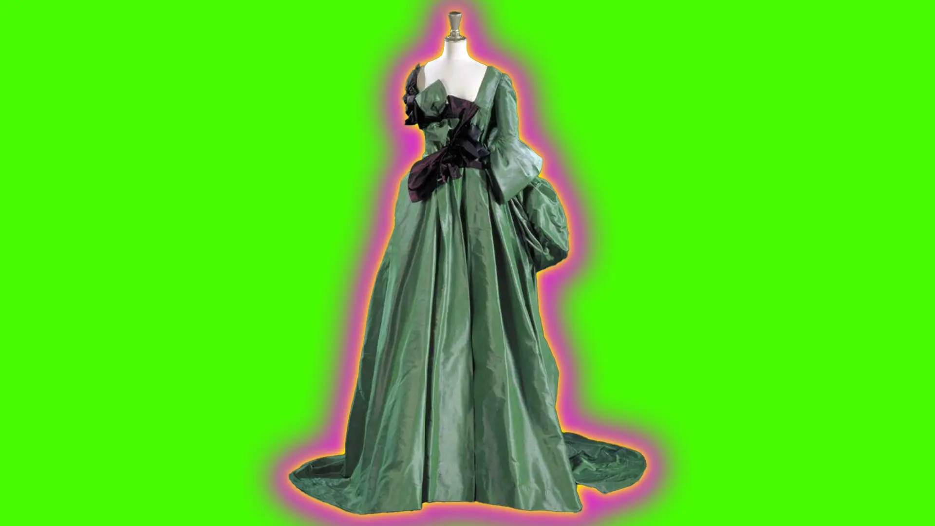 A photo of a green silk gown designed by Vivienne Westwood with a dark maroon bow wrapped around the bodice. It is set against a neon green background with a pink and yellow halo.