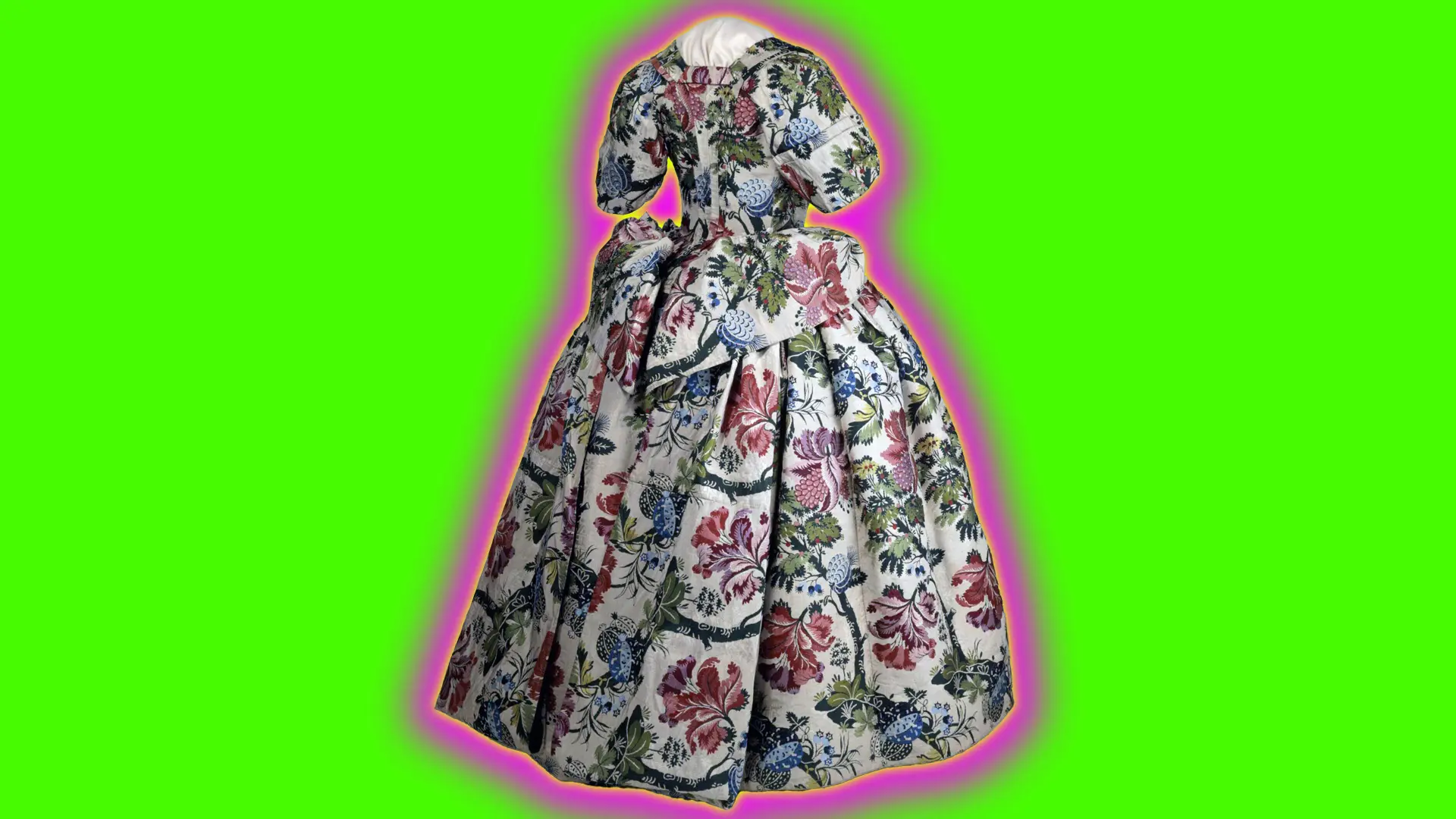 A photograph of a mantua dress shown from the back with it's large flat folded material over the hip and long wide skirt in a chintzy floral pattern set against a neon green background with a pink and yellow halo.