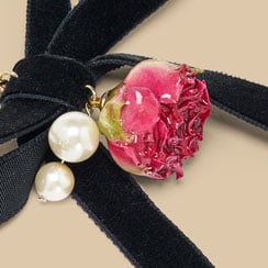 A rosebud necklace pendant.