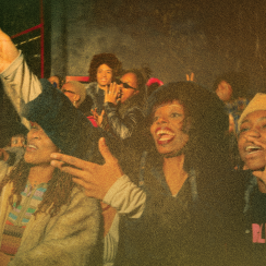 A club crowed enjoyes the music.