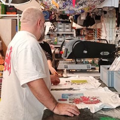 Imprint Works screenprinting t-shirts in their London studio.