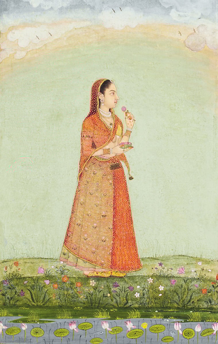 A lady with a bowl of rose flowers