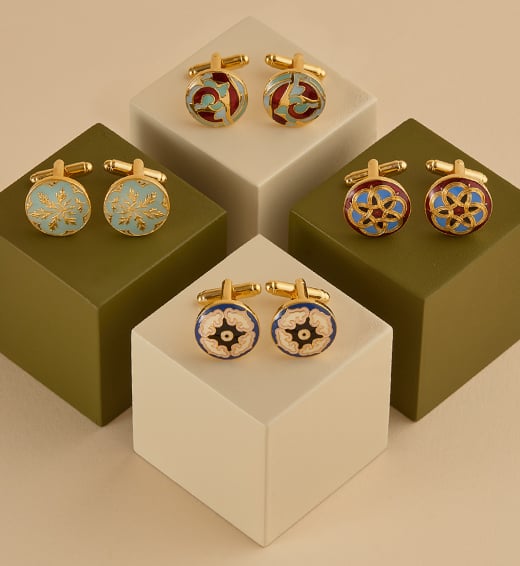 A showcase of enamelled cufflinks inspired by decorative artist Owen Jones